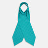 View 3 of product The Turquoise Dotted Check Pattern Printed Silk Cravat by Turnbull & Asser features a neatly folded diamond shape and a refined white dotted grid, showcasing classic style.