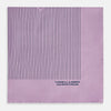 View 4 of product The Lilac Stripe Silk Pocket Square by Turnbull & Asser features thin vertical navy stripes on folded silk, with "TURNBULL & ASSER HAND PRINTED IN ENGLAND" inscribed in the bottom right corner, reflecting British heritage.
