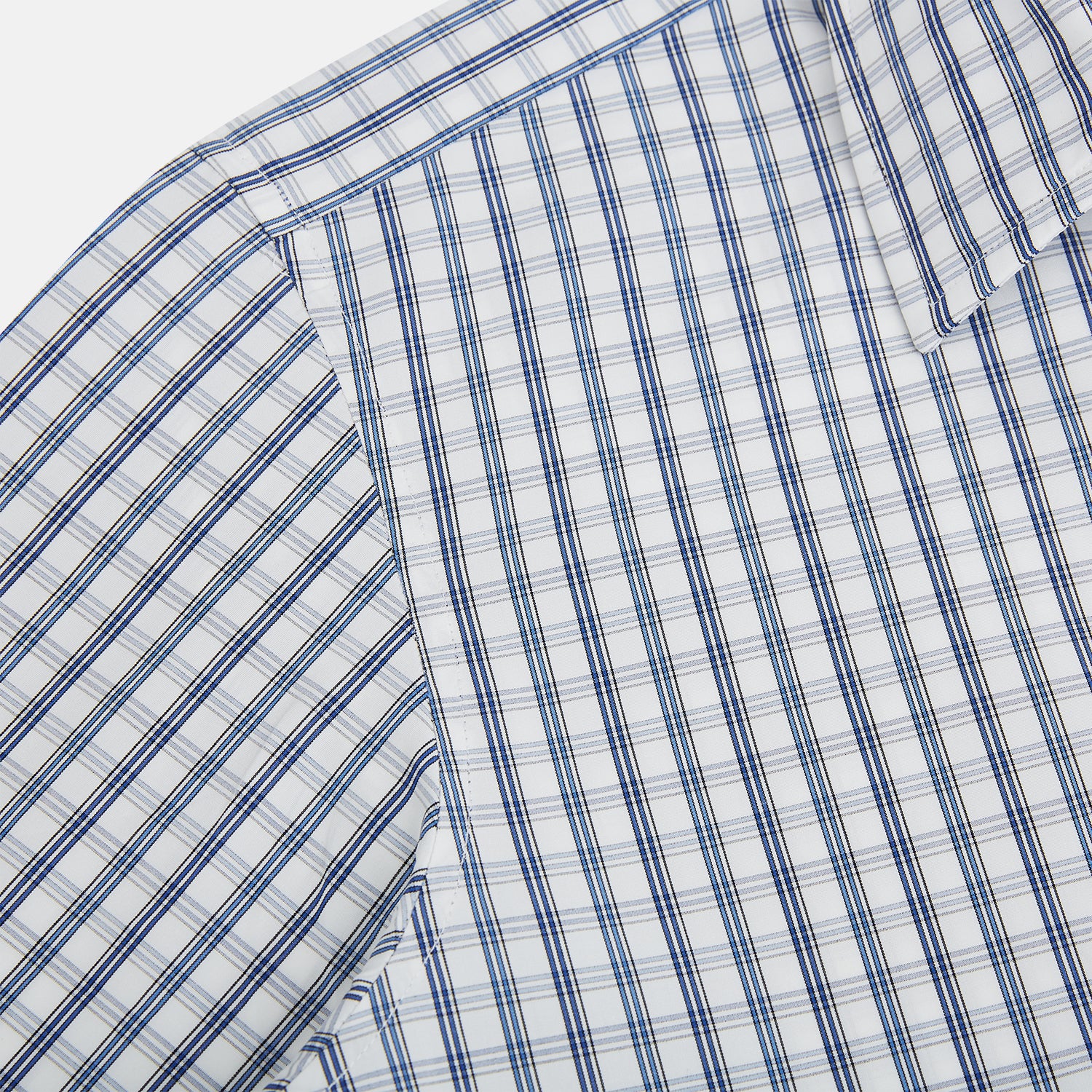 View 6 of product The Azzurro Multi Check Westminster Shirt by Turnbull & Asser is a long-sleeve, button-up with a white base and blue and gray checks, displayed flat against a white background.
