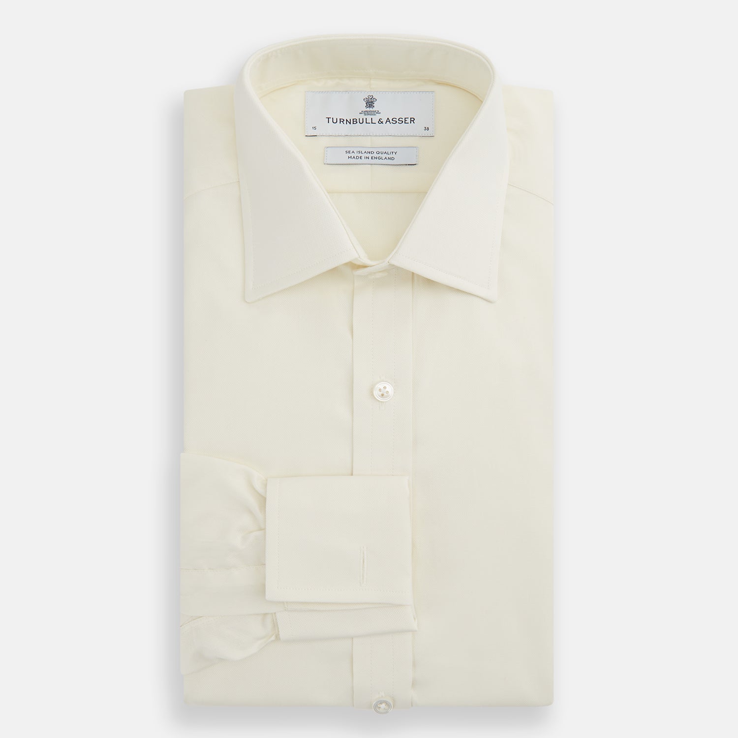 View 4 of product The Turnbull & Asser Tomorrow Never Dies Cream Cotton Hamburg Shirt, as seen on James Bond, features a long sleeve, button-down front, and collar. It's laid flat on a white background.