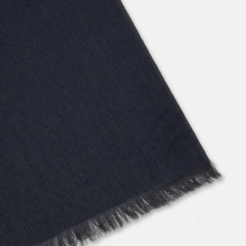 The Turnbull & Asser Brown and Navy Cashmere Scarf features a long, rectangular shape, color block design, soft texture, and lightly frayed edges, elegantly folded on a plain white background.