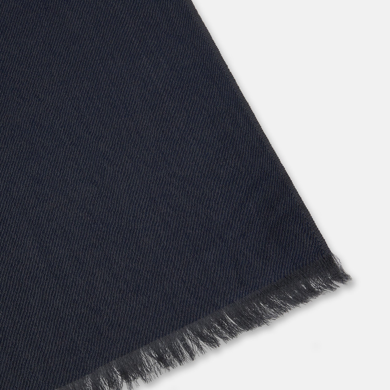 View 2 of product The Turnbull & Asser Brown and Navy Cashmere Scarf features a long, rectangular shape, color block design, soft texture, and lightly frayed edges, elegantly folded on a plain white background.