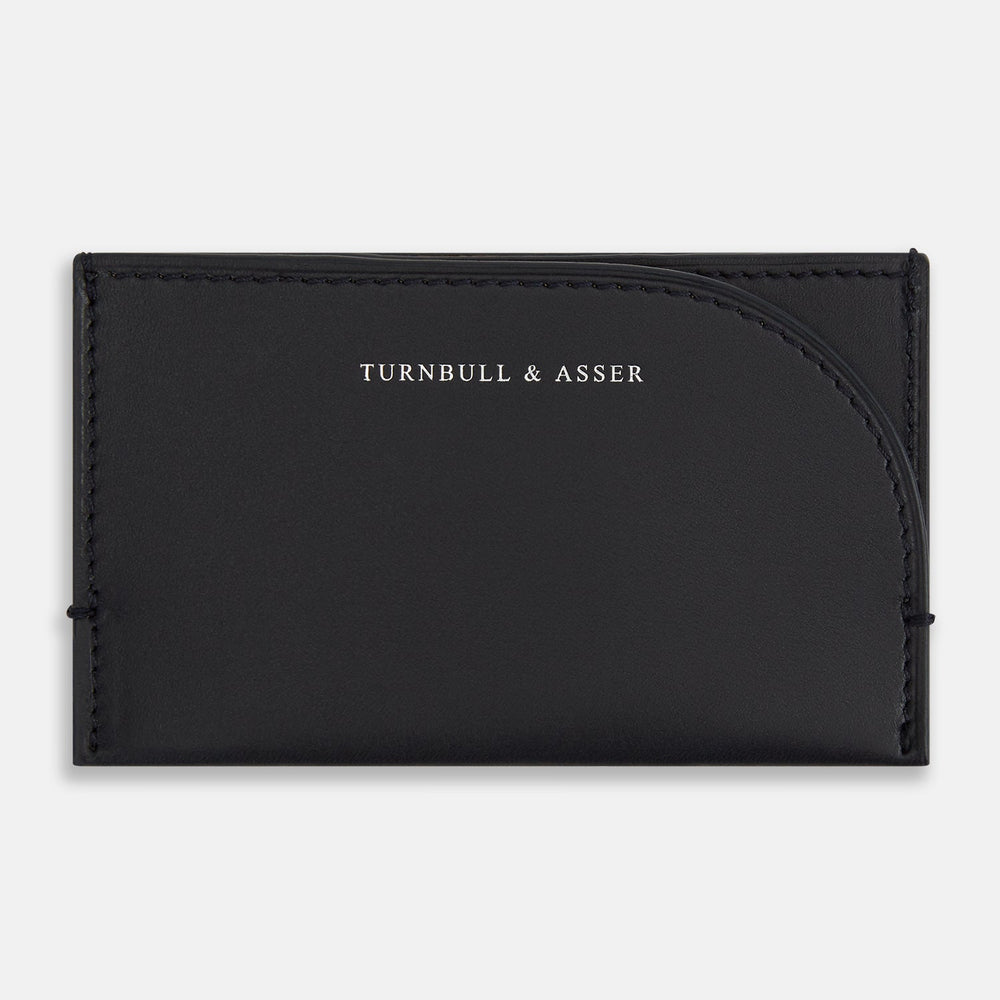 A refined navy Slim Rounded Card Case by Turnbull & Asser, crafted from Italian leather with neat stitching and the brand’s logo embossed in white on the front—perfect for carrying everyday essentials.