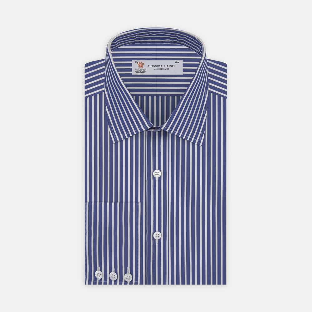 A close-up of Turnbull & Asser's Navy and White Deep Stripe Cotton Fabric shows vertical blue and white stripes bordered by gray, set against a light gray background.