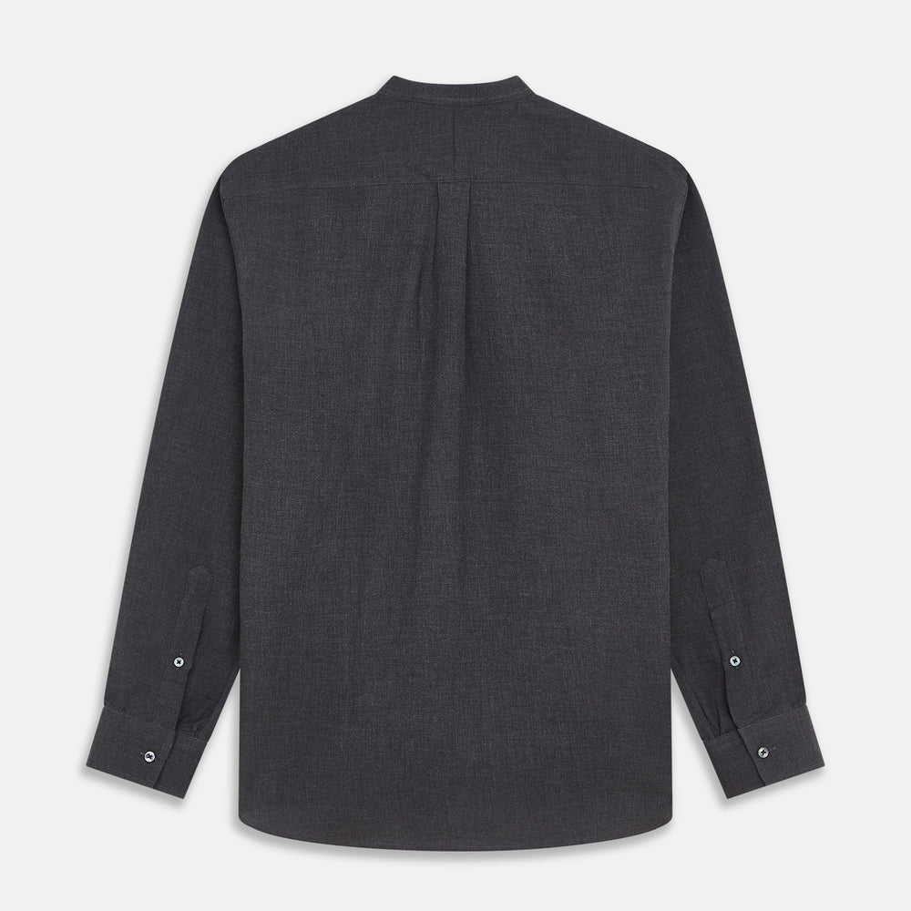 The Turnbull & Asser Charcoal Cotton Blend Weekend Fit Blake Shirt is a long-sleeve, stand-collar shirt with white buttons. Its minimalist design, with no pockets or patterns, makes it perfect for casual wear. Displayed flat on a white background.