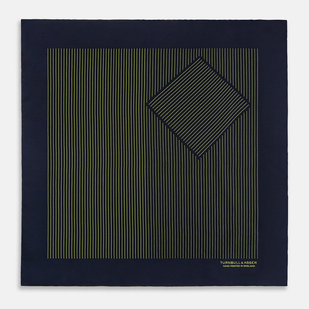 Turnbull & Asser Navy and Yellow Stripe Silk Pocket Square features hand-rolled edges, striped pattern, and "Turnbull & Asser Hand Printed in England" text in yellow on the bottom right corner.