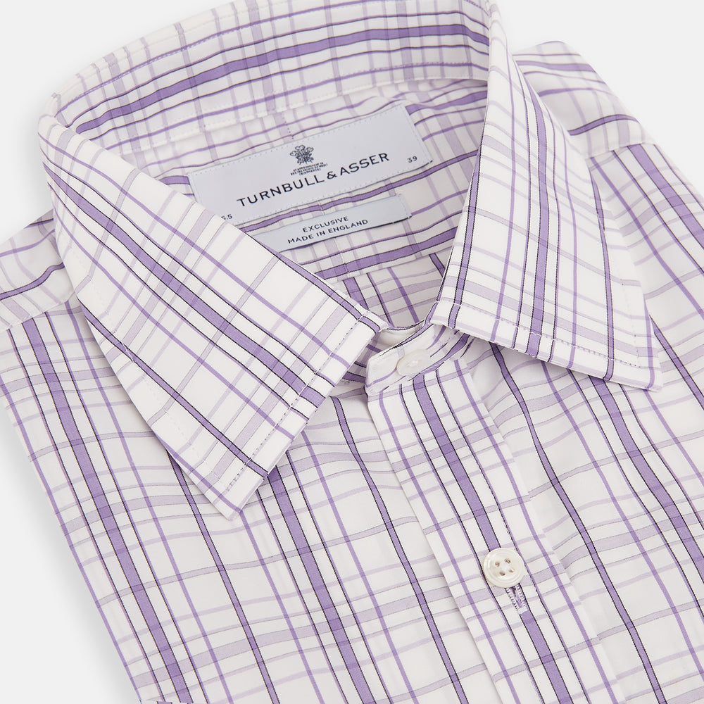The Turnbull & Asser Purple Plaid Check Mayfair Shirt is a long-sleeve button-down with a pointed T&A collar, featuring a purple and blue plaid pattern on white.