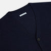 View 2 of product The Turnbull & Asser Navy Fine Merino V-Neck Cardigan features long sleeves, ribbed cuffs and hem, and is crafted from premium yarn for comfort and style, shown on a white background.