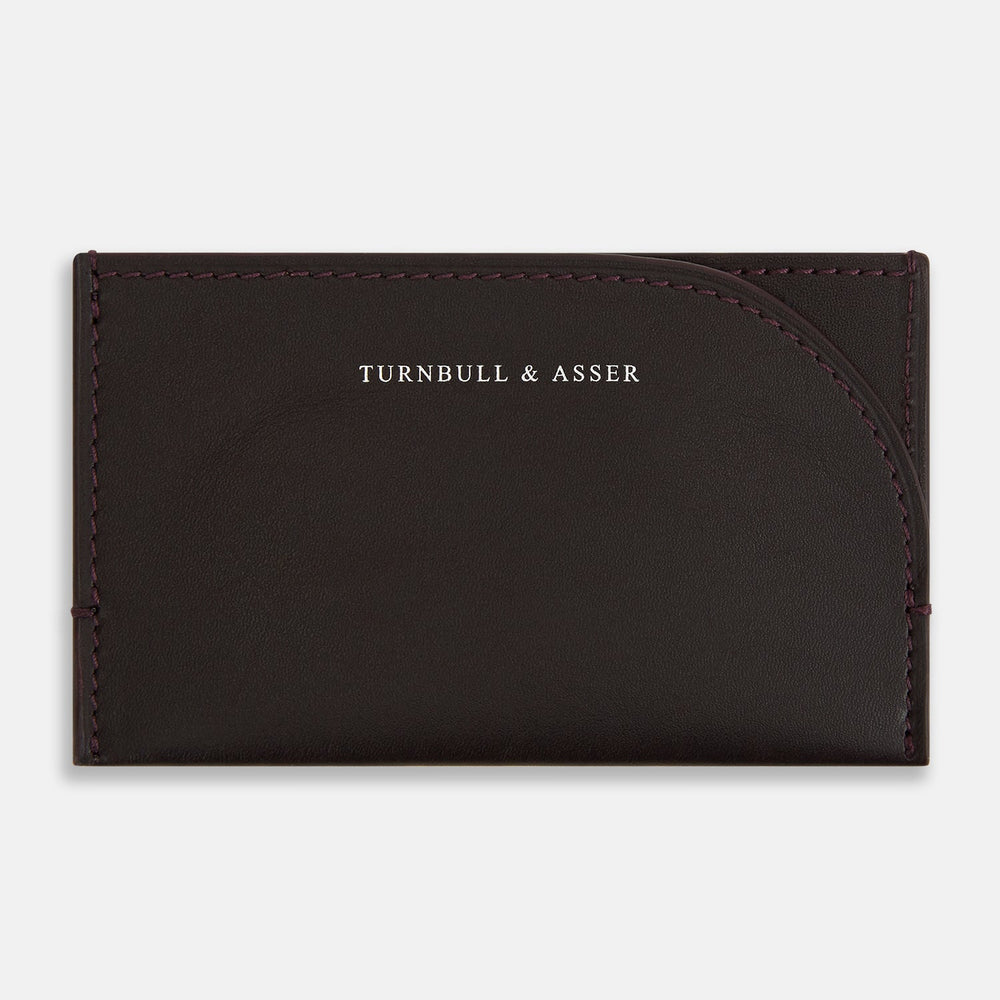 A burgundy leather Slim Rounded Card Case by Turnbull & Asser, featuring subtle stitching and "Turnbull & Asser" printed in white on the front.