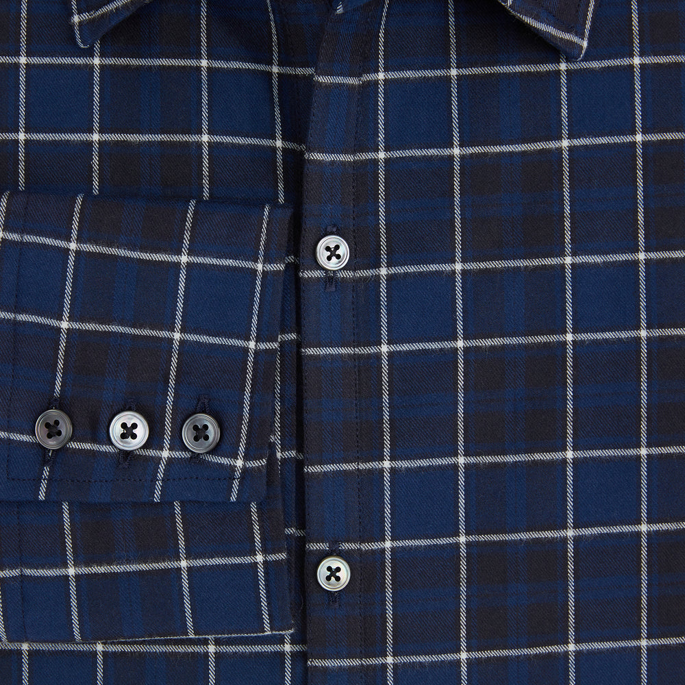 The Turnbull & Asser Navy and White Check Windsor Shirt features a long-sleeve design with a navy base and white check pattern, showcasing British craftsmanship and displayed on a white background.
