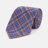 View 1 of product The Turnbull & Asser Blue Multi Tartan Silk Tie features a vibrant blue, yellow, and pink plaid pattern and is shown rolled up on a white background.
