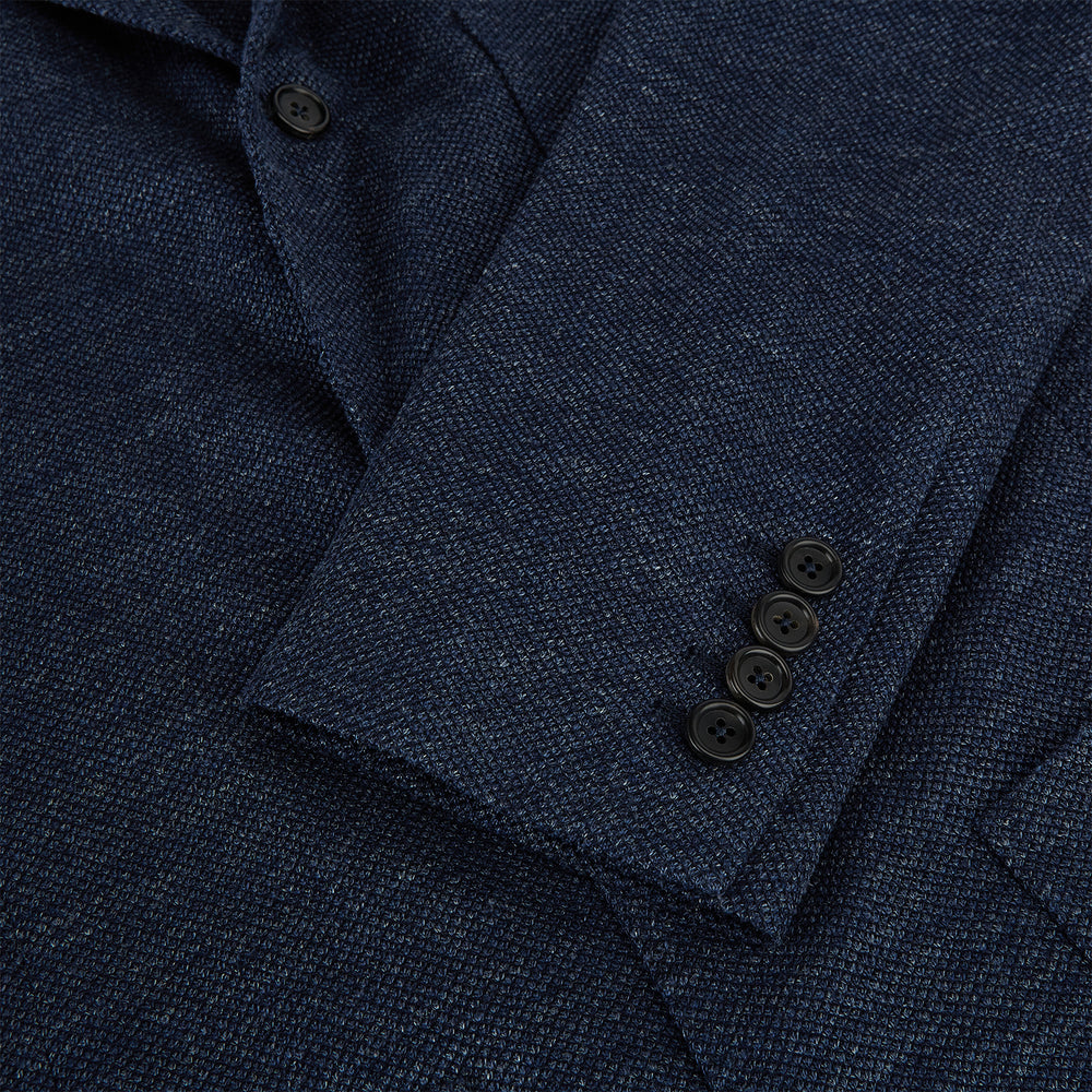 The Turnbull & Asser Navy Linen Blend Cambridge blazer features British tailoring with a notched lapel, two buttons, and three front pockets, shown on a plain white background.