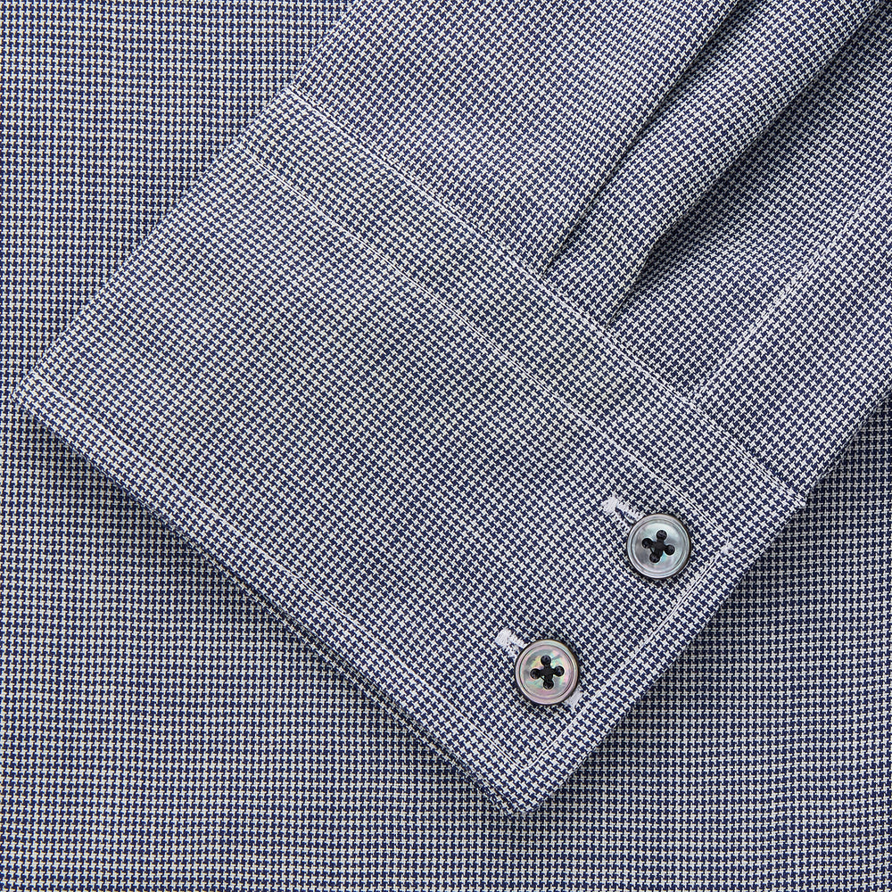 The Turnbull & Asser Navy Houndstooth Wool Tailored Fit Shelton Shirt features a classic collar, buttoned cuffs, and a refined tailored fit, shown laid flat on a white background.