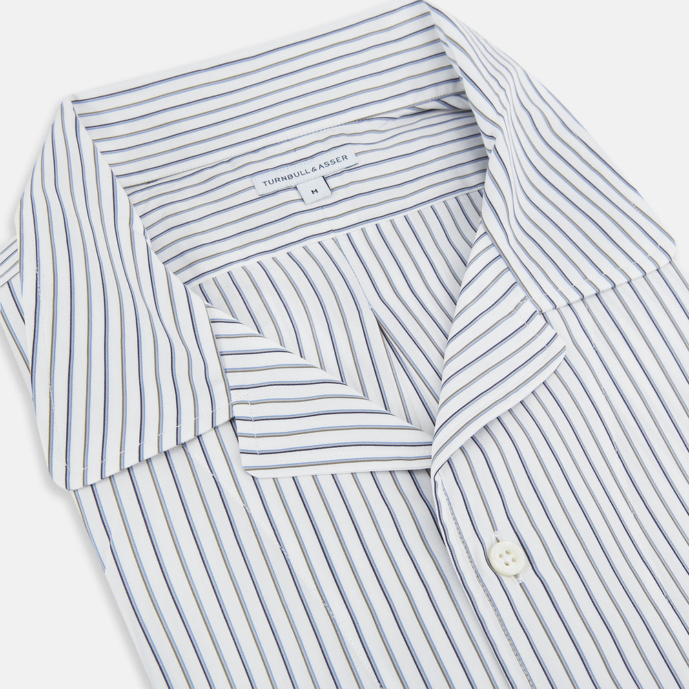 The Brown Multi Stripe Quarzo Nightshirt by Turnbull & Asser is a long-sleeve, knee-length Italian cotton nightshirt with brown and blue stripes, a collar, button placket, chest pocket, and cuffs. The dress is laid flat on a white background.