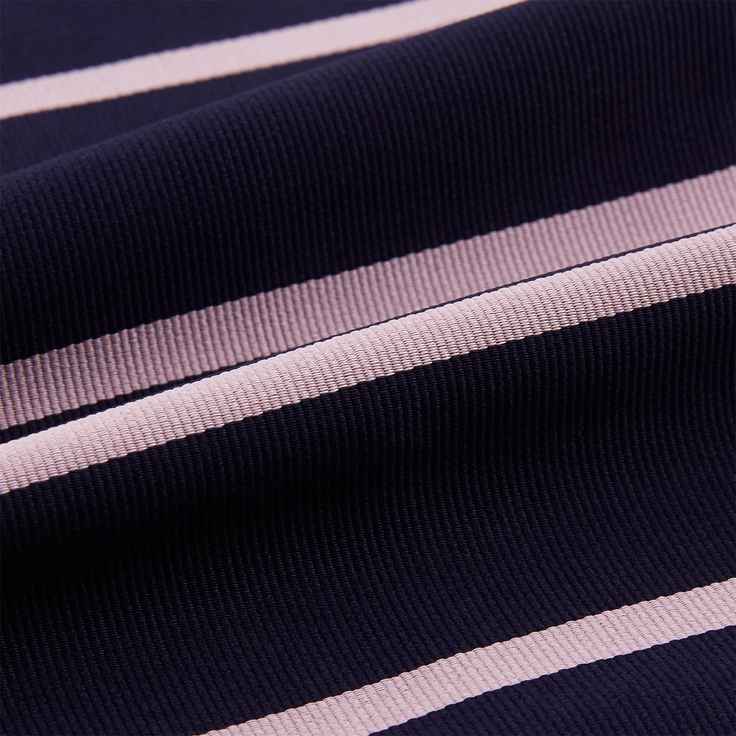 View 4 of product The Turnbull & Asser Pink Stripe and Navy Silk Cravat features evenly spaced light pink stripes on navy silk—a refined British style wedding accessory, elegantly displayed against a white background.