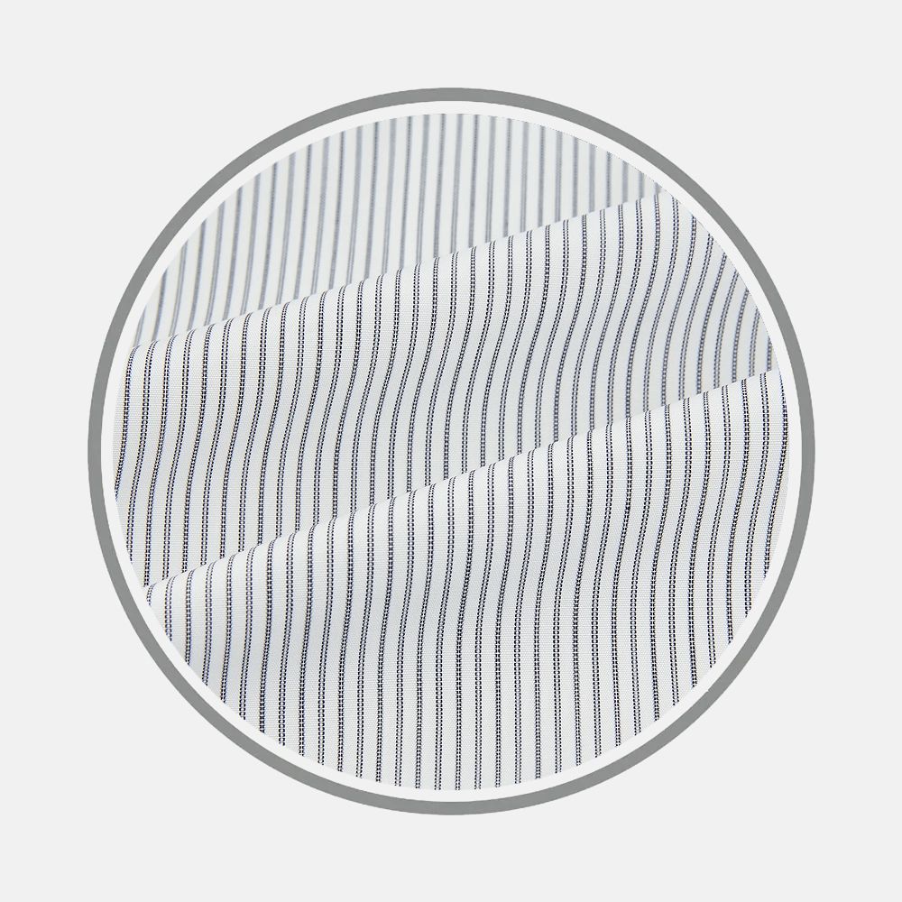 Close-up of Turnbull & Asser's Blue Ticking Pinstripe Fabric, featuring white material with evenly spaced, thin navy blue vertical stripes, displayed inside a circular frame on a plain background.