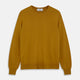 The Turnbull & Asser Gold Crew Neck Merino Jumper, featuring long sleeves and ribbed cuffs and hem, is displayed flat on a white background.