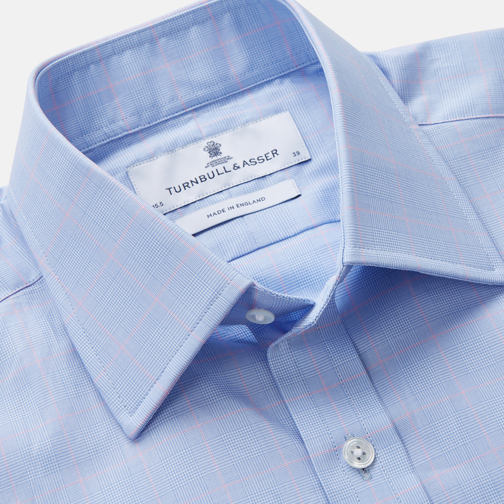 A Turnbull & Asser Blue and Pink Prince of Wales Check Mayfair Shirt with long sleeves, classic collar, buttoned front and cuffs, is neatly laid flat on a white background.