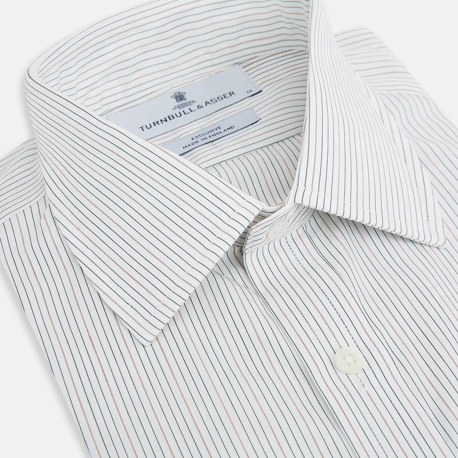 View 2 of product The Petrol Hairline Stripe Mayfair Shirt by Turnbull & Asser is a long-sleeved, button-up Italian cotton shirt with a subtle blue pinstripe, classic T&A collar, and buttoned cuffs, shown flat on a white background.