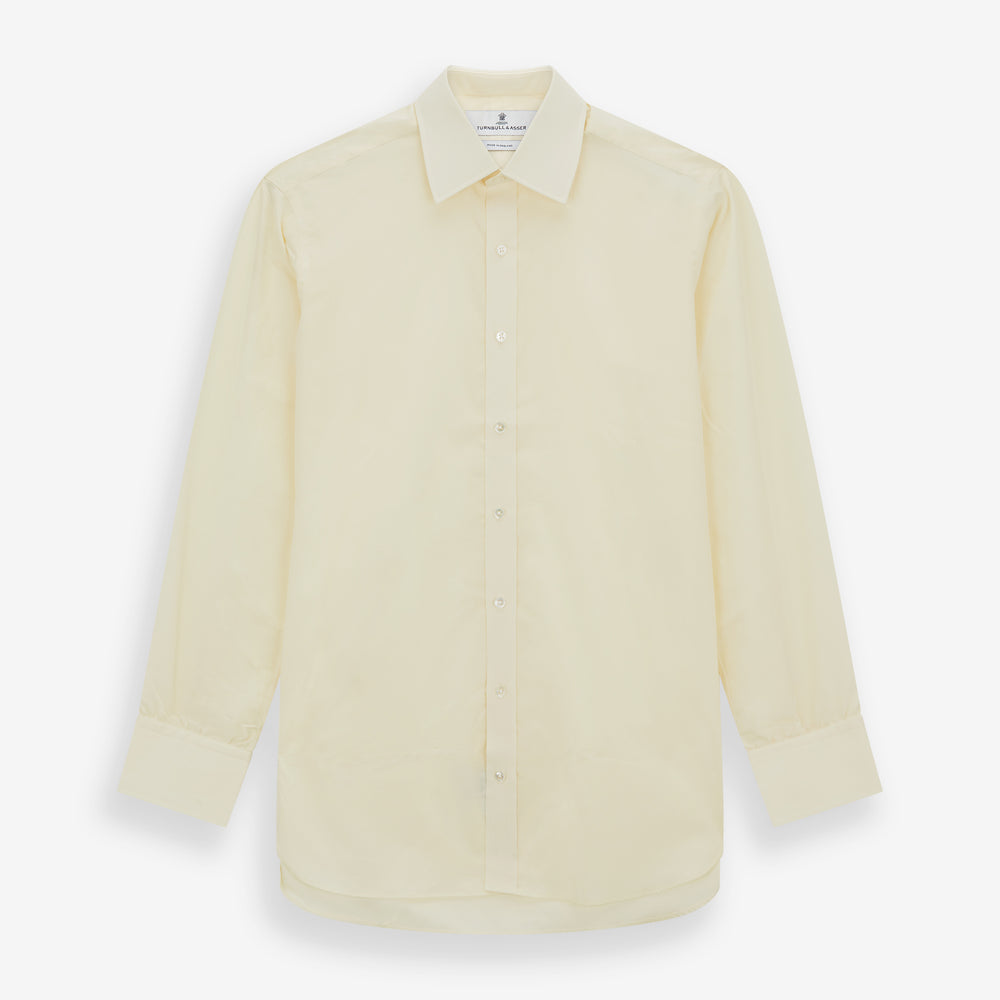 The Cream Cotton Shirt with T&A Collar and 3-Button Cuffs by Turnbull & Asser is ideal for minimalist styles or pairing with bold ties. Shown on a plain white background.