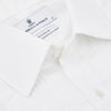 View 5 of product A neatly folded Die Another Day Inspired Voile Dress Shirt by Turnbull & Asser, featuring a classic collar and buttoned front, is displayed on a white background, evoking the timeless style of a James Bond shirt.