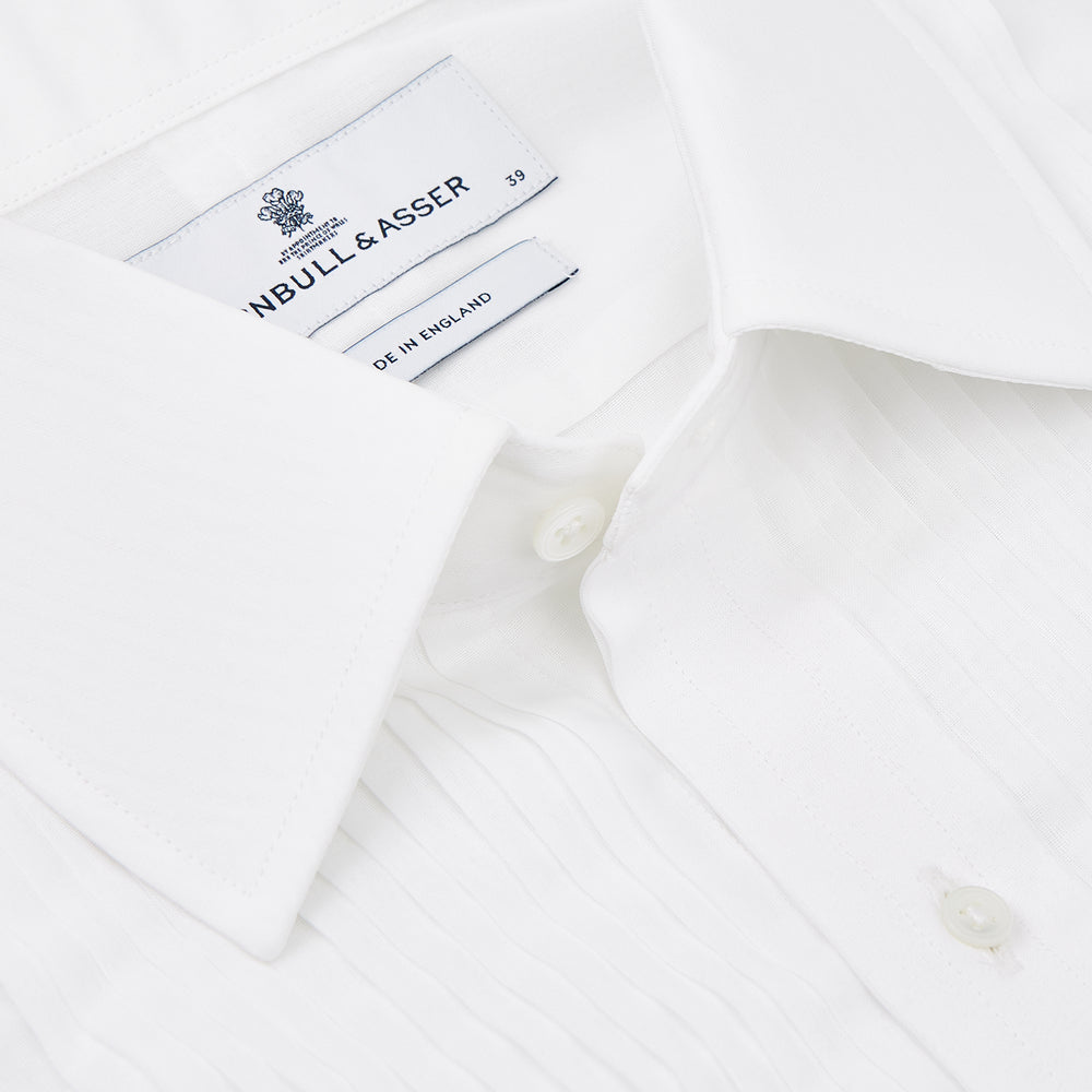 A neatly folded Die Another Day Inspired Voile Dress Shirt by Turnbull & Asser, featuring a classic collar and buttoned front, is displayed on a white background, evoking the timeless style of a James Bond shirt.