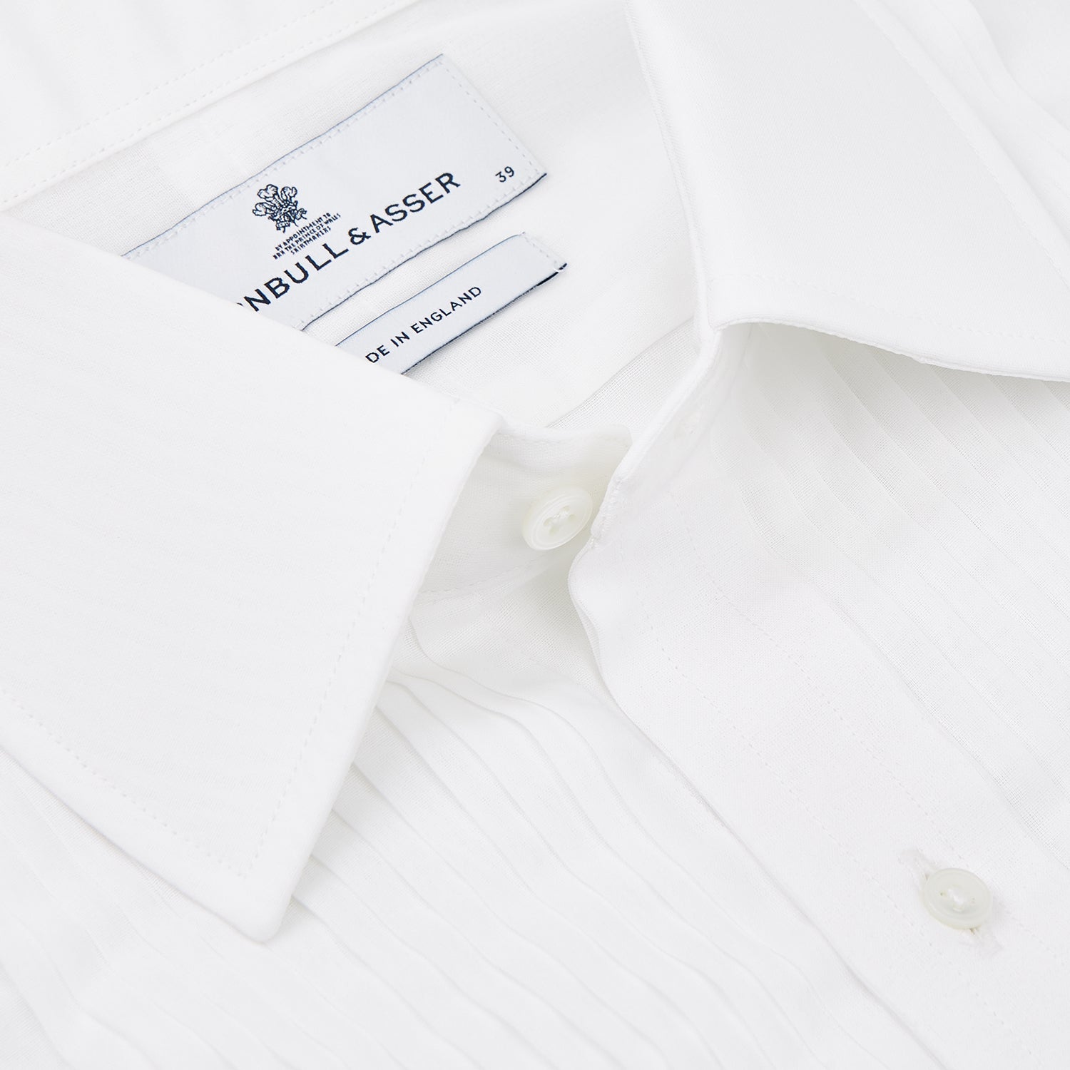 View 5 of product A neatly folded Die Another Day Inspired Voile Dress Shirt by Turnbull & Asser, featuring a classic collar and buttoned front, is displayed on a white background, evoking the timeless style of a James Bond shirt.