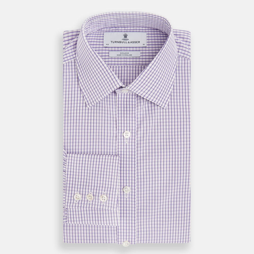 The Turnbull & Asser Purple Micro Shadow Check Mayfair Shirt features long sleeves, a classic collar, white buttons, and a subtle blue and white check pattern—perfect for formal wear and shown on a plain white background.