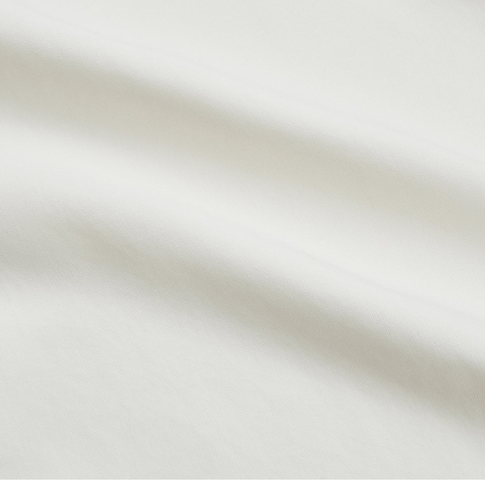 The Turnbull & Asser Cream Silk Weekend Fit Fairlight Shirt is a classic, soft-touch long-sleeve shirt with a collar, button-down front, and buttoned cuffs, shown laid flat on a plain white background.