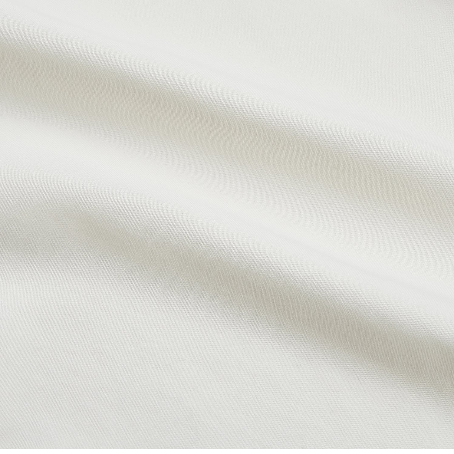 View 2 of product The Turnbull & Asser Cream Silk Weekend Fit Fairlight Shirt is a classic, soft-touch long-sleeve shirt with a collar, button-down front, and buttoned cuffs, shown laid flat on a plain white background.