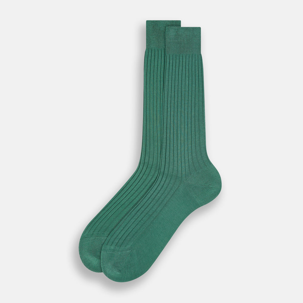 The Turnbull & Asser Sage Mid-Length Sock is shown angled on a white background, emphasizing its ribbed texture and length—a refined, comfortable sock designed for style.