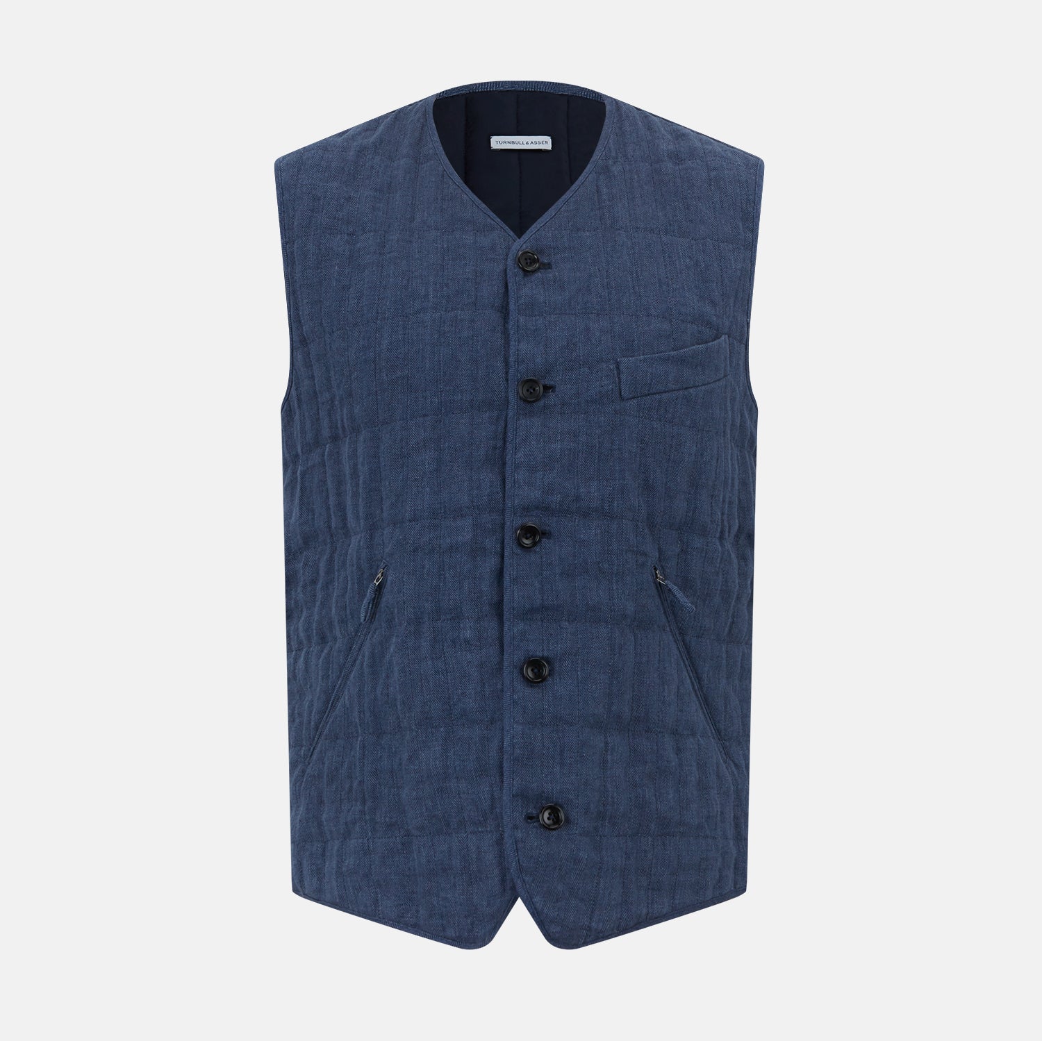 View 1 of product The Denim Blue Quilted Linen Herringbone Waistcoat by Turnbull & Asser features a sleeveless design, five black buttons, two zippered side pockets, and a small chest pocket against a plain white background.