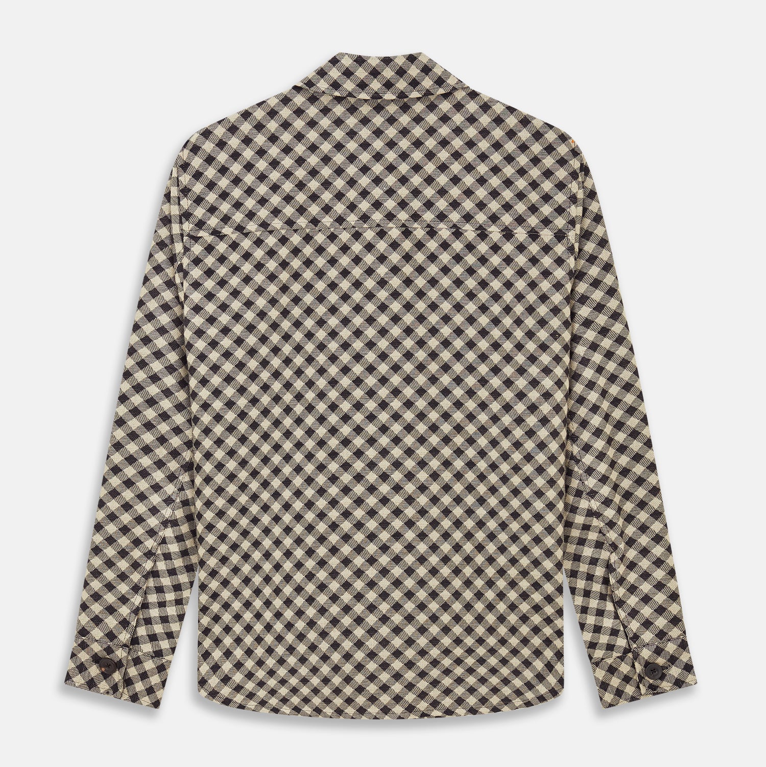 View 4 of product The Turnbull & Asser Black Gingham Check Wool Blend Somerset Overshirt features long sleeves, two chest flap pockets with buttons, and a black-and-beige check pattern. Shown laid flat on a white background; ideal as transitional outerwear.