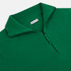 View 2 of product The Grass Green Half-Zip Cashmere Jumper by Turnbull & Asser is a long-sleeve knitwear pullover with a high collar and front half-zip closure, shown against a plain white background.