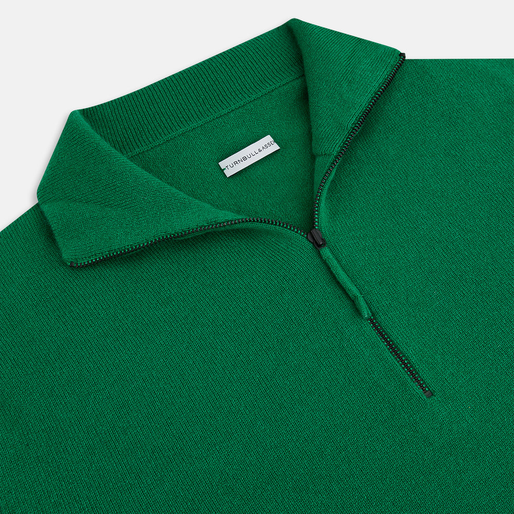 The Grass Green Half-Zip Cashmere Jumper by Turnbull & Asser is a long-sleeve knitwear pullover with a high collar and front half-zip closure, shown against a plain white background.