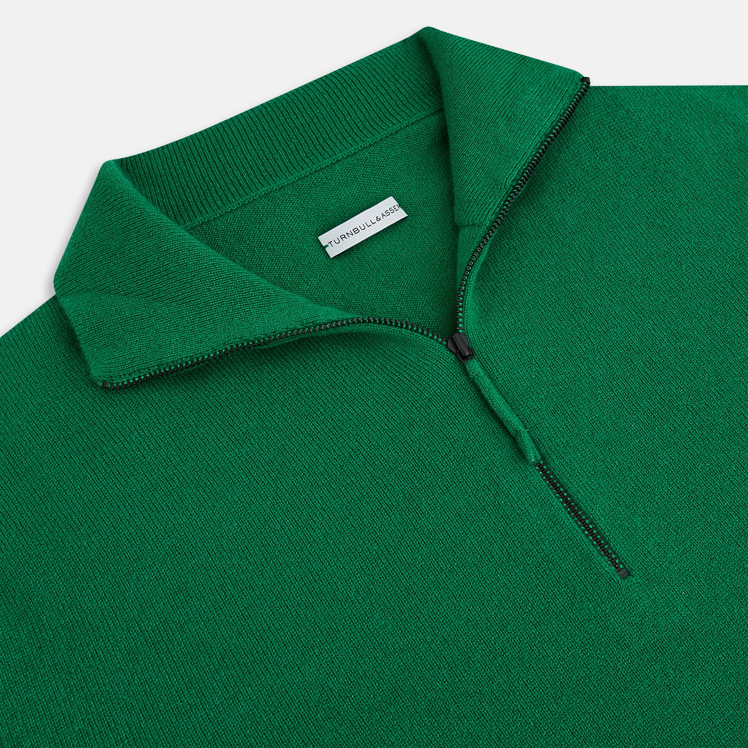 View 2 of product The Grass Green Half-Zip Cashmere Jumper by Turnbull & Asser is a long-sleeve knitwear pullover with a high collar and front half-zip closure, shown against a plain white background.