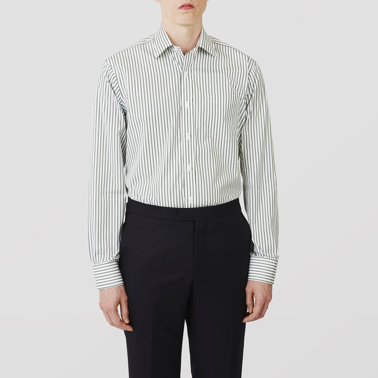 View 2 of product The Turnbull & Asser Green Stripe Weekend Fit Shirt features a derby collar, 1-button cuffs, and relaxed fit, perfect for smart-casual style, shown laid flat on a white background.