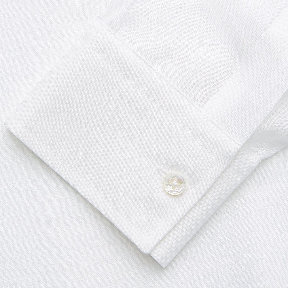 The Turnbull & Asser White Weekend Fit Linen Finch Shirt features a Derby collar and chest pocket, laid flat on a white background—an effortlessly classic choice for casual weekends.