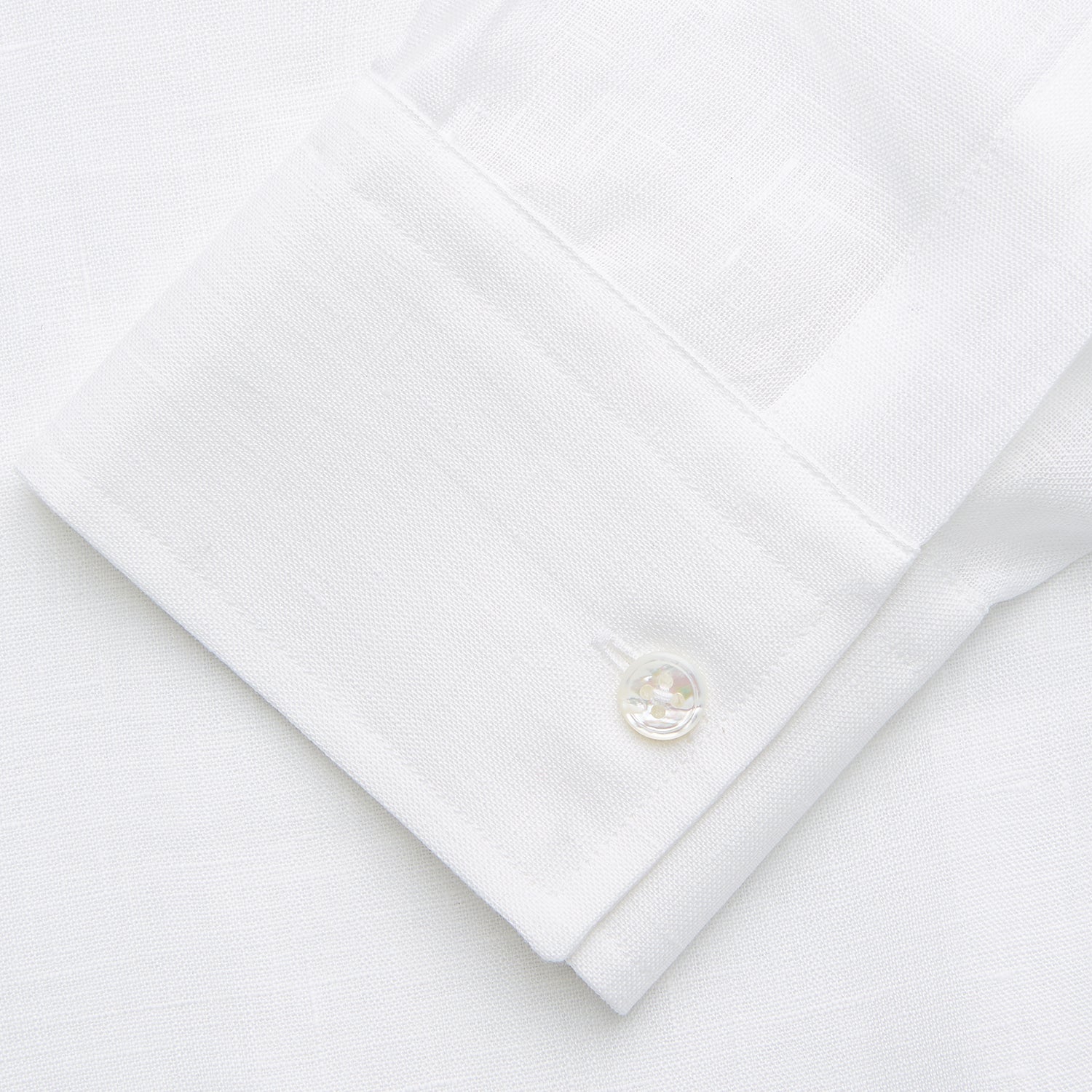 View 4 of product The Turnbull & Asser White Weekend Fit Linen Finch Shirt features a Derby collar and chest pocket, laid flat on a white background—an effortlessly classic choice for casual weekends.