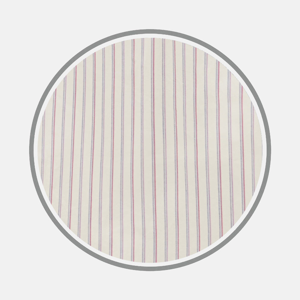 A close-up of Turnbull & Asser’s Pink Double Stripe Fabric, featuring cream fabric with thin, evenly spaced vertical pink stripes, displayed within a circular frame on a light gray background.