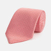View 1 of product The HOUNDSTOOTH WHITE TULIP RED TIE by Turnbull & Asser features a refined red and white houndstooth pattern—an elegant accessory that elevates any crisp shirt or formal look.
