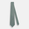 View 2 of product The Turnbull & Asser Light Blue and Chartreuse Lemon Weave Patterned Silk Tie, crafted from fine English silk, features a geometric design in blue and green tones, displayed on a plain white background.