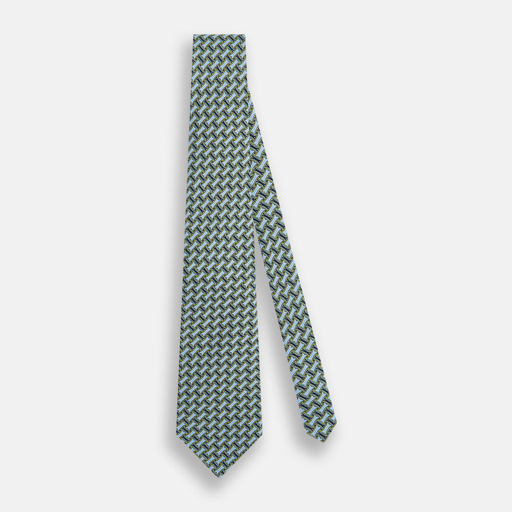 The Turnbull & Asser Light Blue and Chartreuse Lemon Weave Patterned Silk Tie, crafted from fine English silk, features a geometric design in blue and green tones, displayed on a plain white background.