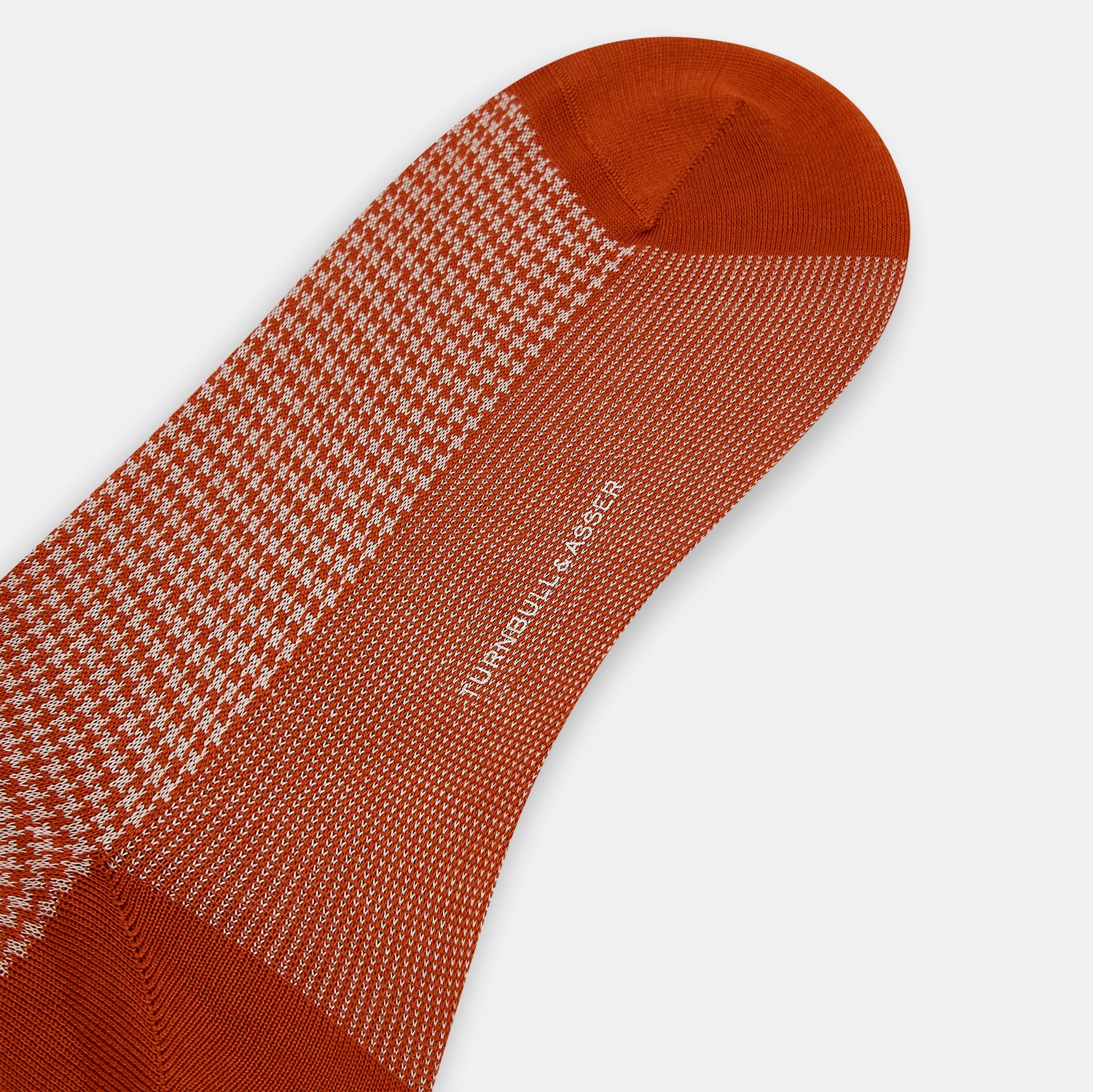 View 3 of product The Rose Houndstooth Mid-Length Sock by Turnbull & Asser, shown in red and white with solid red toe, heel, and cuff, is displayed on a plain white background.