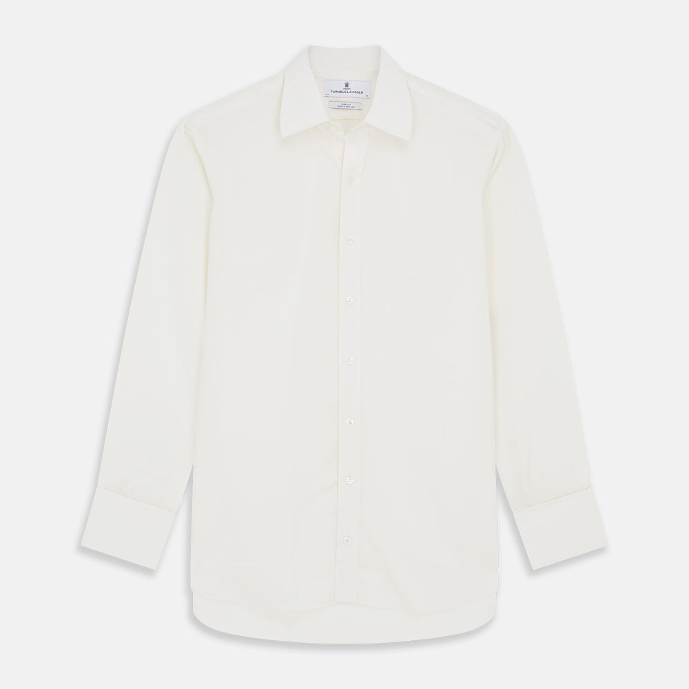 The Cream Silk Whitby Shirt by Turnbull & Asser features a pointed collar, buttoned front and cuffs, and long sleeves, shown in Whitby Fit and laid flat on a white background.