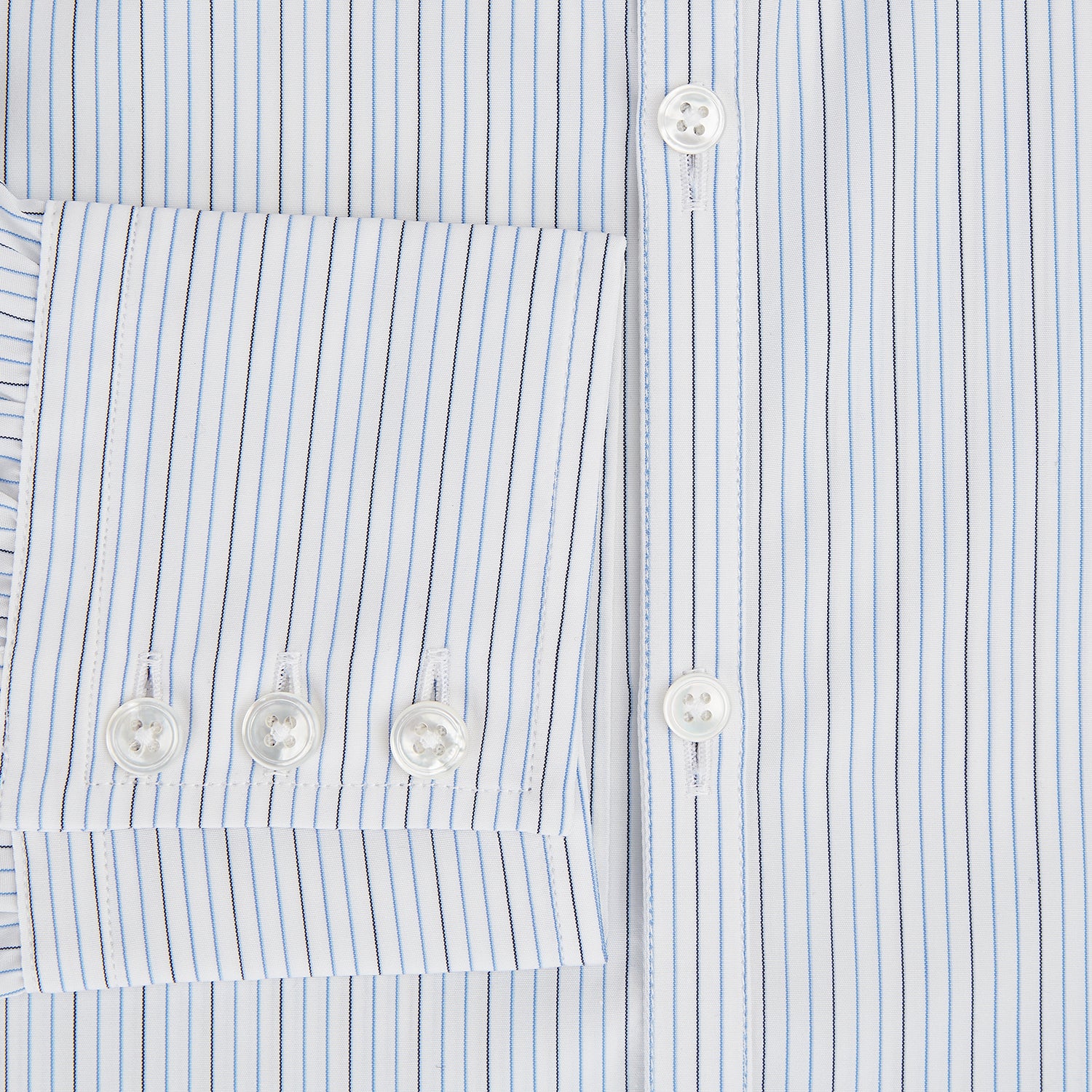 View 4 of product The Turnbull & Asser Pale Blue and Navy Pinstripe Westminster Shirt features long sleeves, a classic collar, and buttoned cuffs, highlighting British craftsmanship. The shirt is laid flat on a white background.