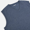 View 2 of product The Avio Blue Cashmere V-neck Vest by Turnbull & Asser is a sleeveless knitwear piece with ribbed hem and armholes, shown against a plain white background.
