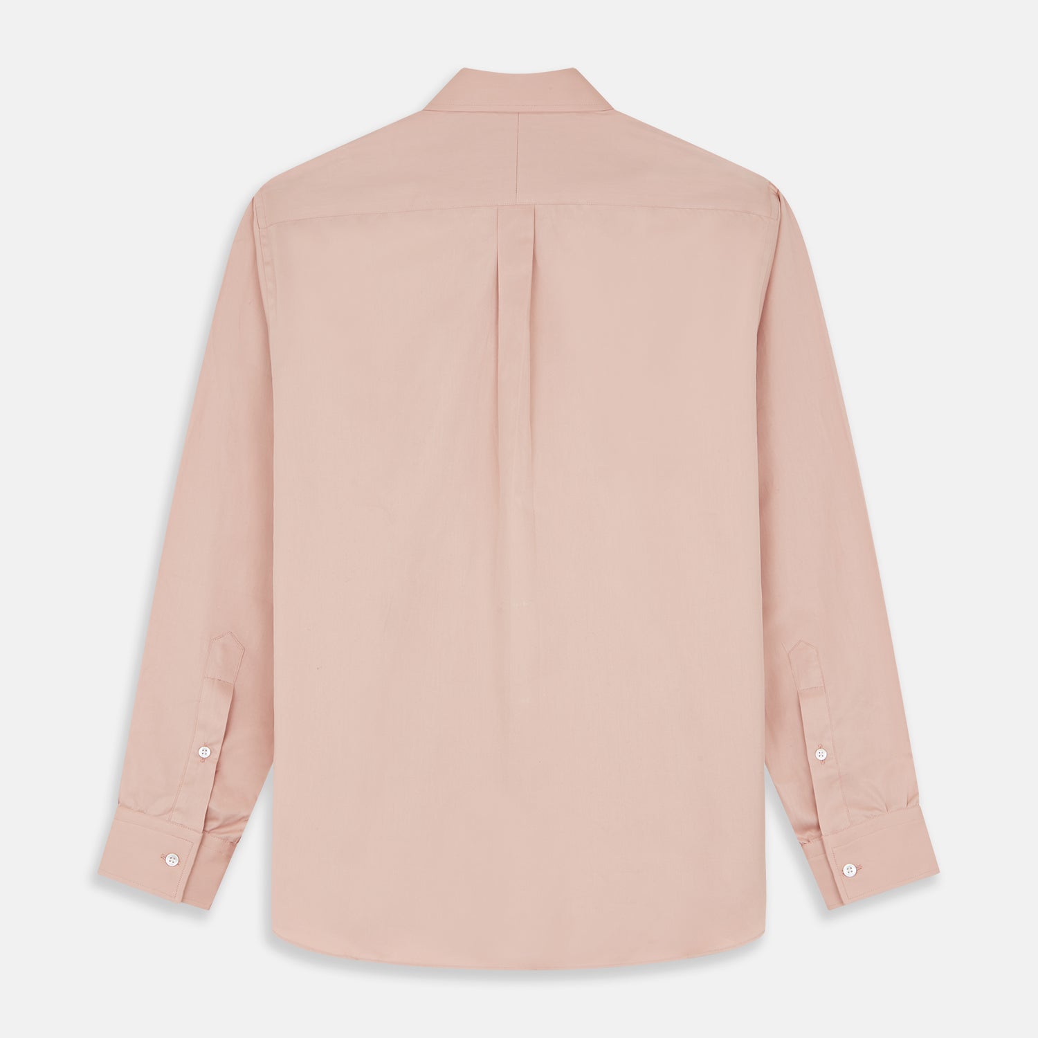 View 8 of product A man faces forward in a relaxed pose against a beige background, wearing the Turnbull & Asser Pink Piece Dyed Weekend Fit Suffolk Shirt with a button-down collar, dark cuffed jeans, and black shoes.