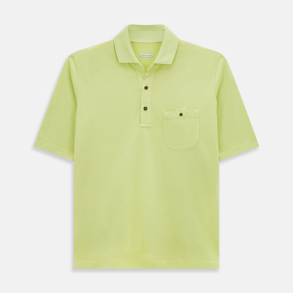 The Turnbull & Asser Lime Green Polo Shirt features a cotton jersey build, short sleeves, a collar, three brown buttons on the placket, and a chest pocket with a button. Shirt shown laid flat on a white background.