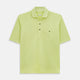 The Turnbull & Asser Lime Green Polo Shirt features a cotton jersey build, short sleeves, a collar, three brown buttons on the placket, and a chest pocket with a button. Shirt shown laid flat on a white background.